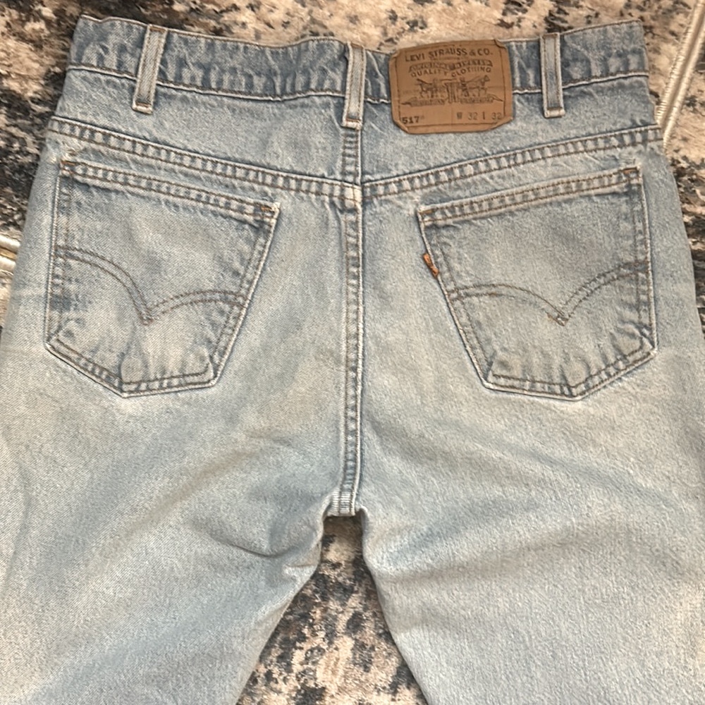 Vintage 517 light wash distressed faded orange tab cotton Levis made in USA 1996